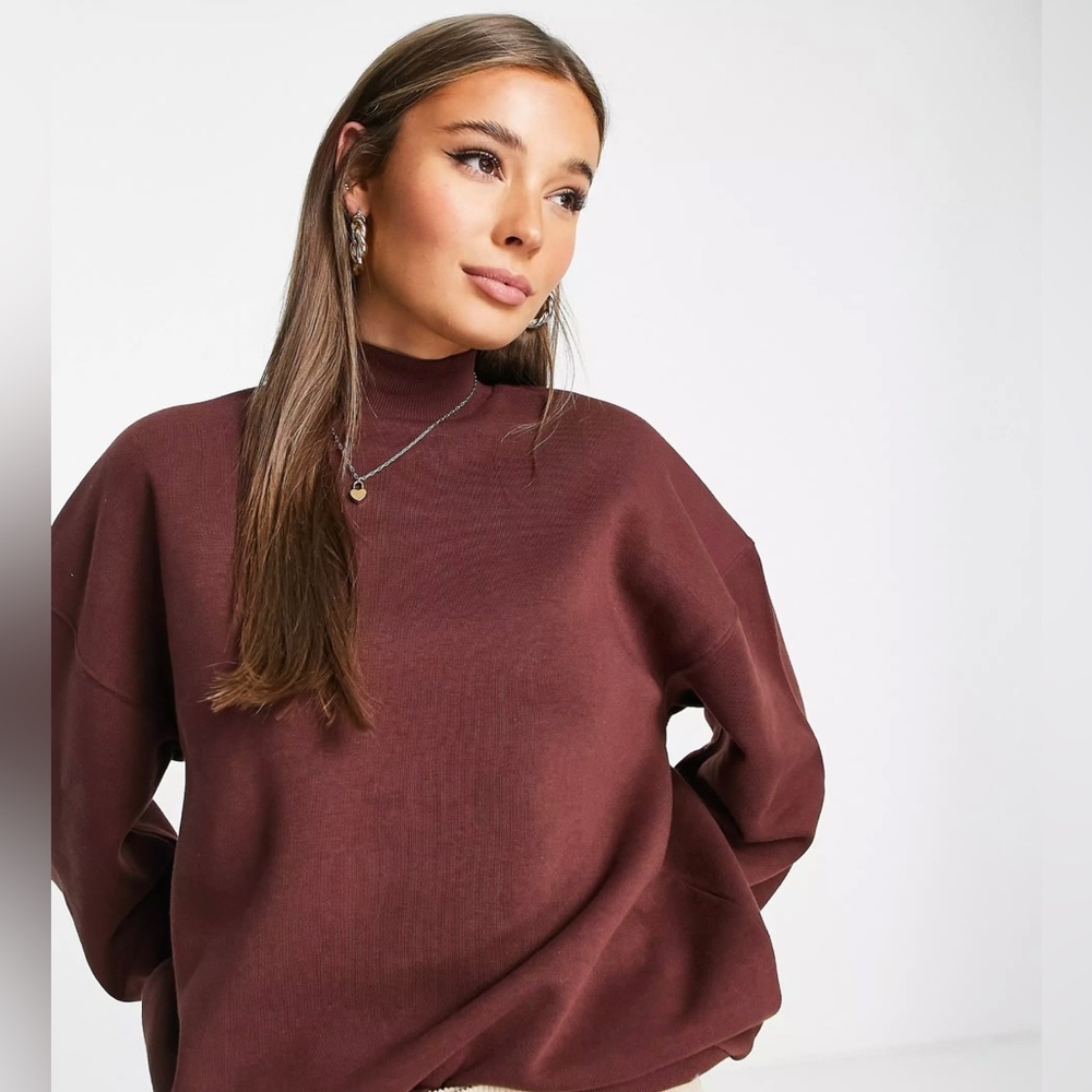 Maroon mock neck sweatshirt.